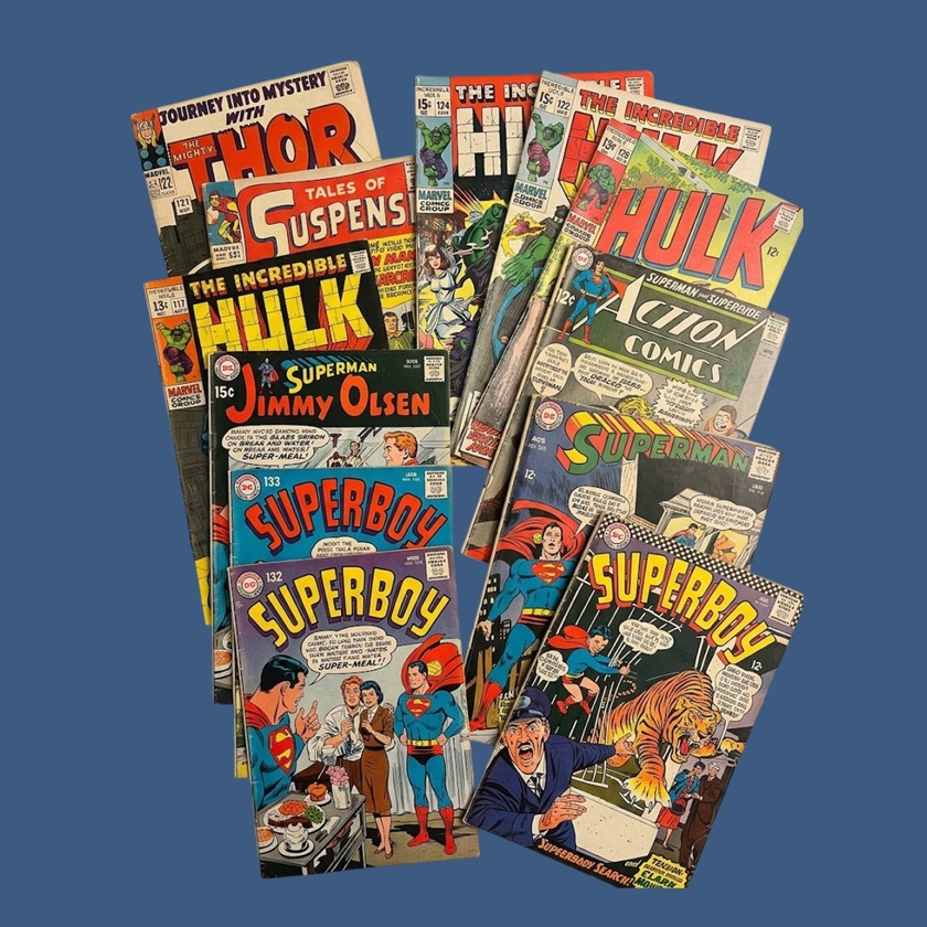 Curated collectibles display featuring comic books, trading cards, and vintage memorabilia